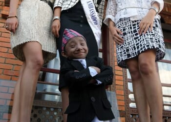 Khagendra Thapa Magar, from Nepal, stood just 2ft 2.4 inches tall when he was officially crowned the world's shortest man by Guinness World Records in 2010. Pictured: Khagendra Thapa Magar poses for a picture with Miss Nepal Sadichha Shrestha (C) and first runner-up Sahana Bajracharya (R) and second runner-up Samyukta Timilsina (L) in Kathmandu