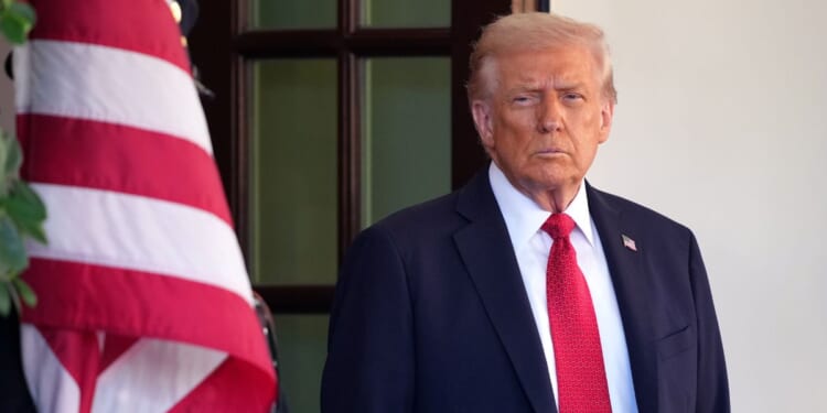 President Donald Trump stands outside the White House in Washington, DC on Oct. 20, 2025.