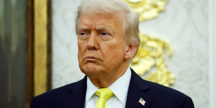 President Donald Trump looks on during a News conference in the Oval Office of the White House in Washington, D.C., on Oct. 15.