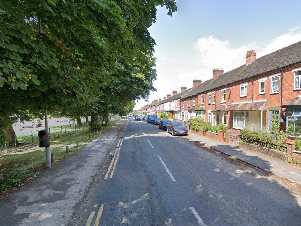 Corporation Street in Stafford, lined with trees on one side and houses on the other.