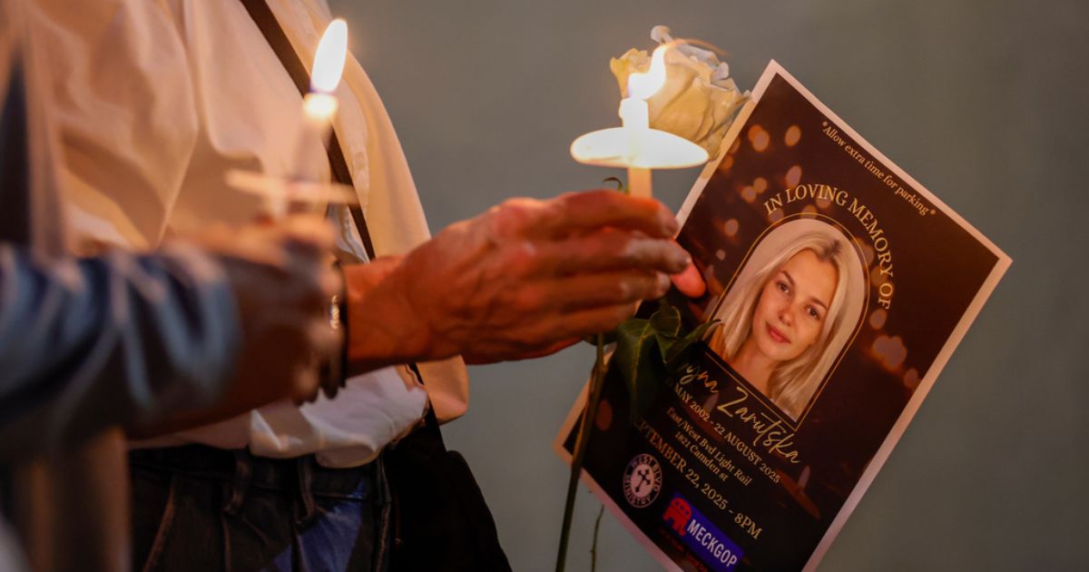 Attendees hold candles at a vigil for Iryna Zarutska in Charlotte, North Carolina, on Sept. 22, 2025.