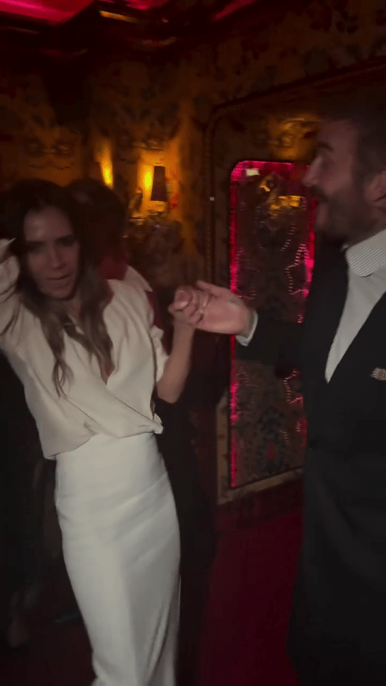 Victoria Beckham and David Beckham dancing.