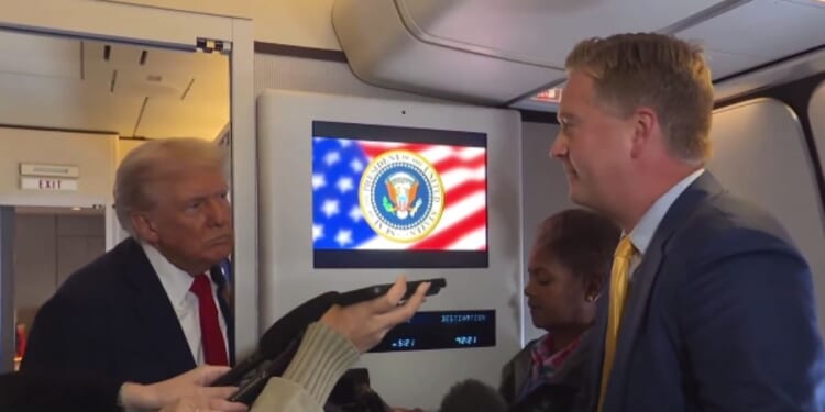 After being asked a question by Fox News' Peter Doocy, right, aboard Air Force One, President Donald Trump, left, discussed his salvation and stated that he was unsure he would be able to get into Heaven.