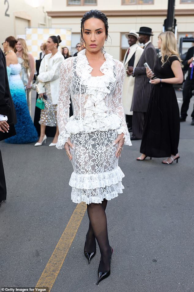 Demi Lovato, styled by Chris Horan, was outshone by white ruffles around her neckline and hemline