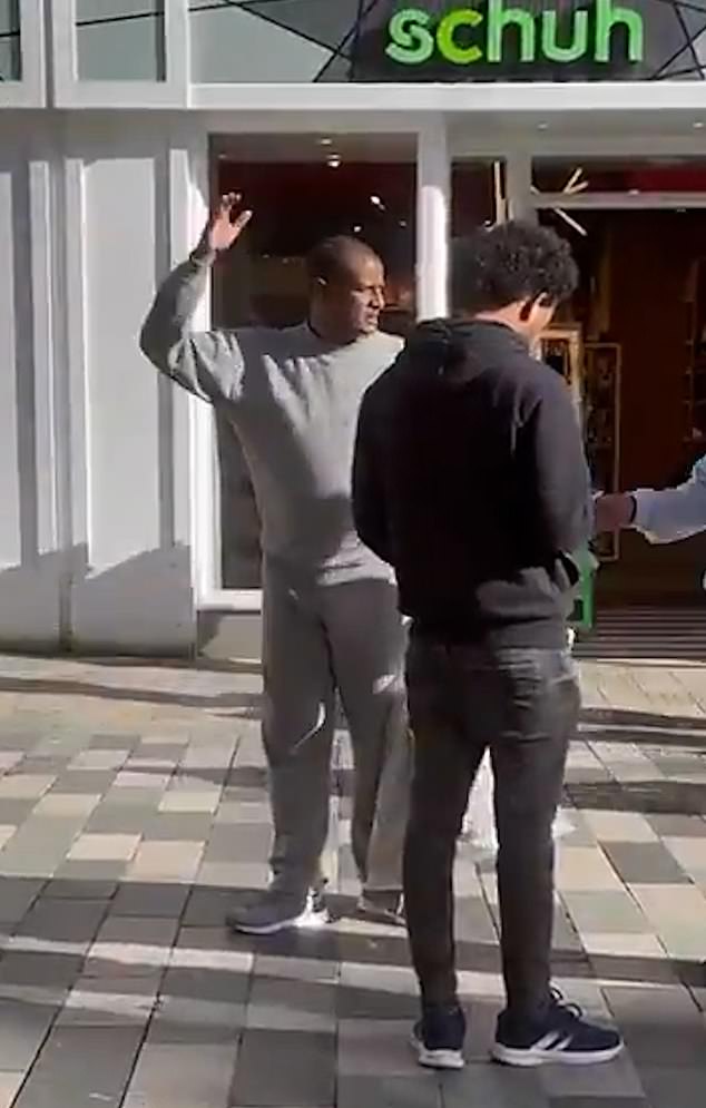 FRIDAY MORNING: Video footage (above) appeared to capture Kebatu in Chelmsford town centre asking for directions from locals, while wearing his prison tracksuit