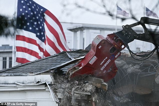 Heavy machinery tears down a section of the East Wing of the White House as construction begins on President Donald Trump's planned ballroom, in Washington, DC, on Wednesday