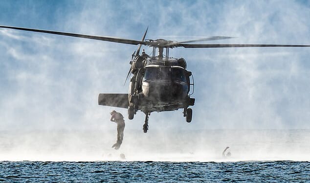 Soldiers jump from a helicopter during a practice operation in the US Virgin Islands as tensions rise between the US and Venezuela