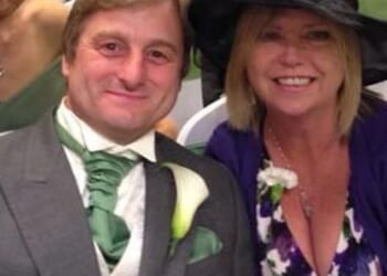 Kevin Holding (left) with his partner Katrine Woods who is suing his employer after he was crushed to death by a pop up toilet