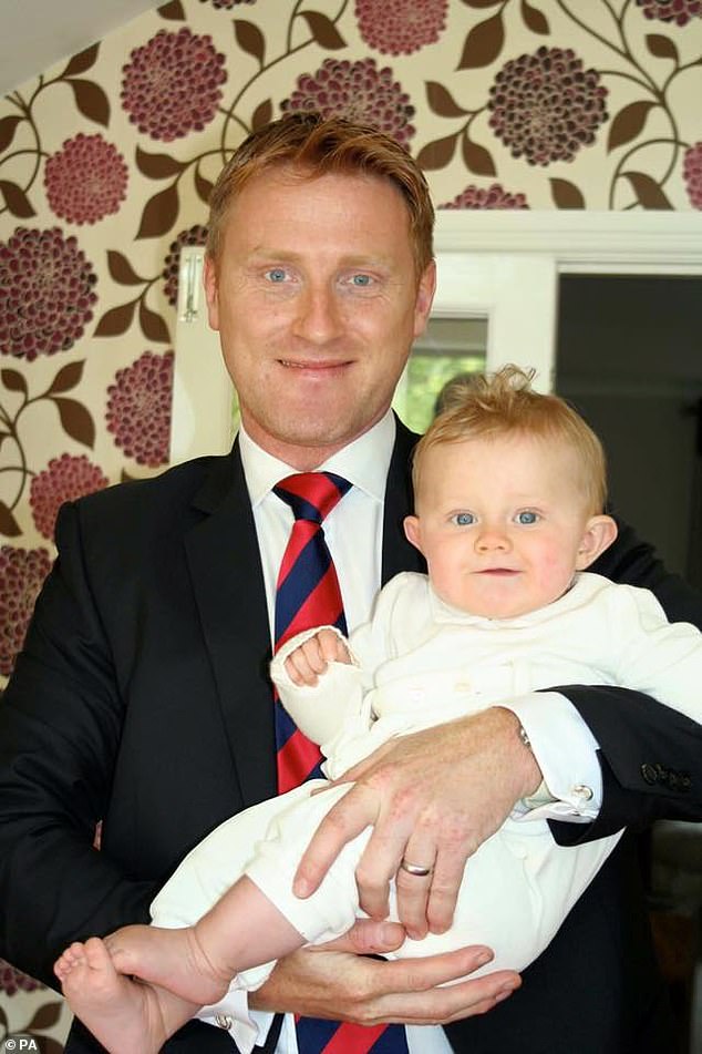 Paul Burke with son George who died aged one year, one week and one day in February 2012
