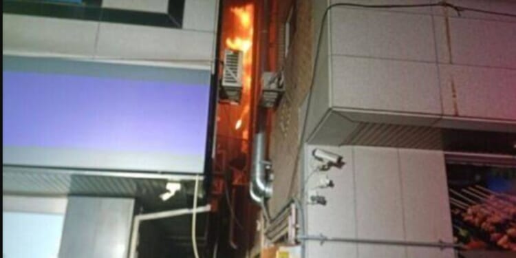 A new mother died in a fire set by a neighbor who was reportedly trying to kill a cockroach.