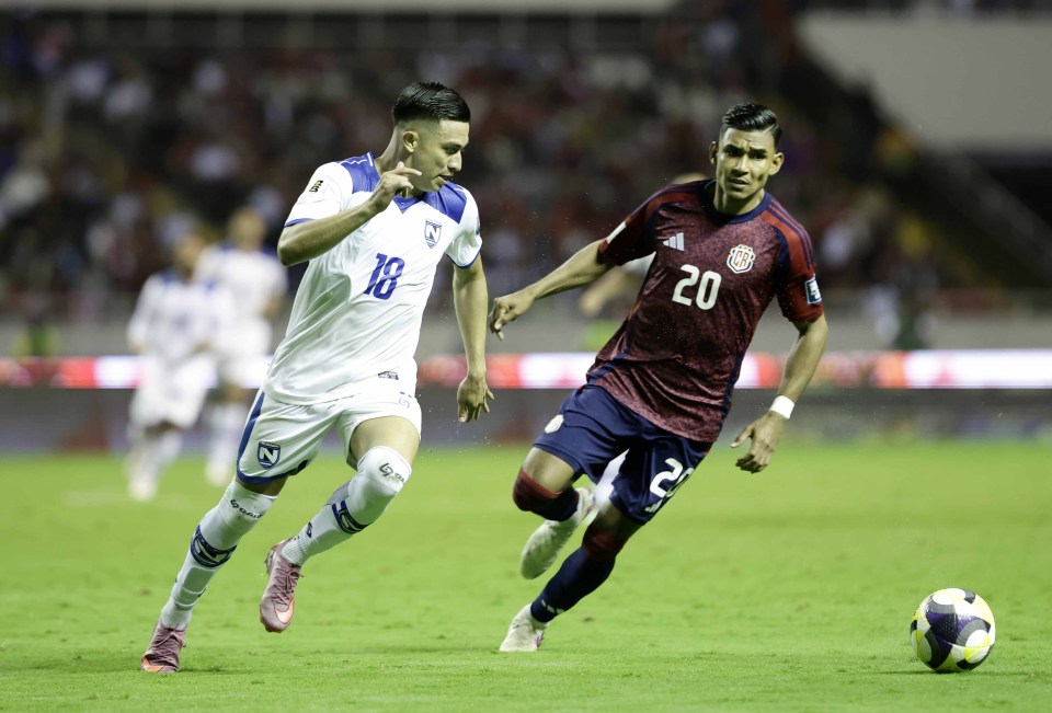 Haxzel Quiros of Costa Rica vies for the ball with Bancy Hernandez of Nicaragua during a CONCACAF 2026 World Cup qualifying soccer match.