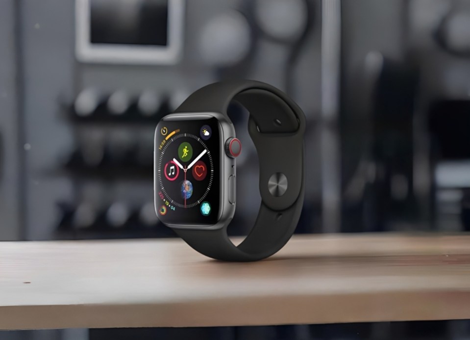 Apple Watch with a black strap, showing various app icons on the screen.