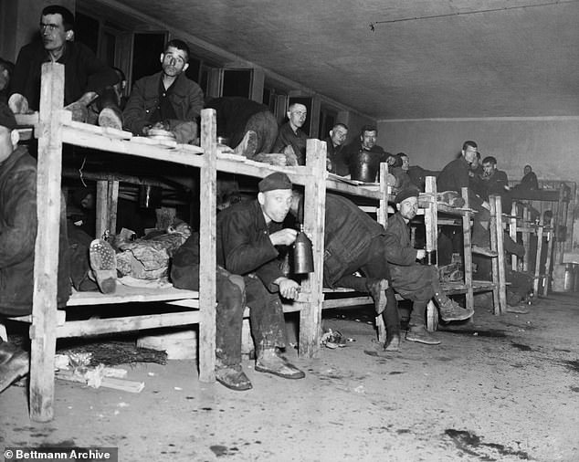 German prosecutors are investigating a 100-year-old man on suspicion he served as a prison guard at a Nazi camp in Hemer, Germany. Pictured: The interior of the 'hospital' room at the Nazi prisoner of war camp near Hemer, Germany