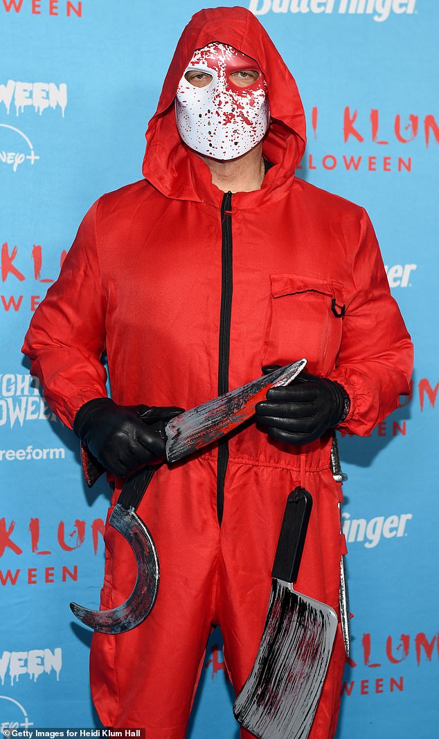 Rapper and actor Ice-T wore a scary costume, as he dressed himself in a red bodysuit covered in fake blood-covered plastic knives. He also wore a white mask that was splattered in fake blood