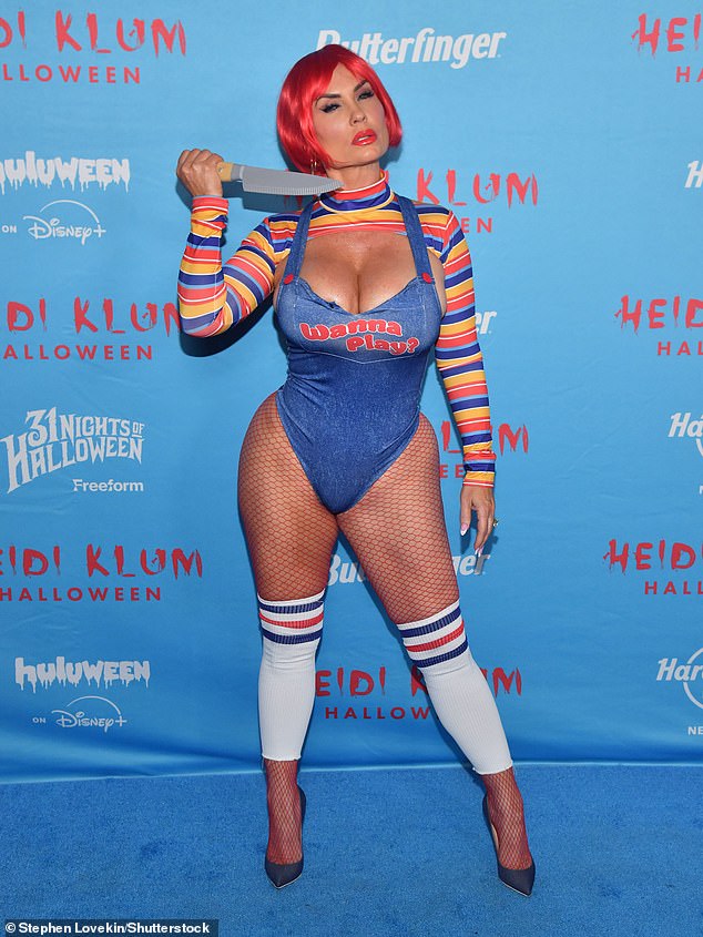 TV personality and Ice-T's wife, Coco Austin, came dressed as as sexy Chucky doll. She leaned all the way into it as she held a fake knife against her neck, and wore a bright red wig. She completed the look with a pair of fishnet tights and a denim bodysuit that read, 'Wanna play?'
