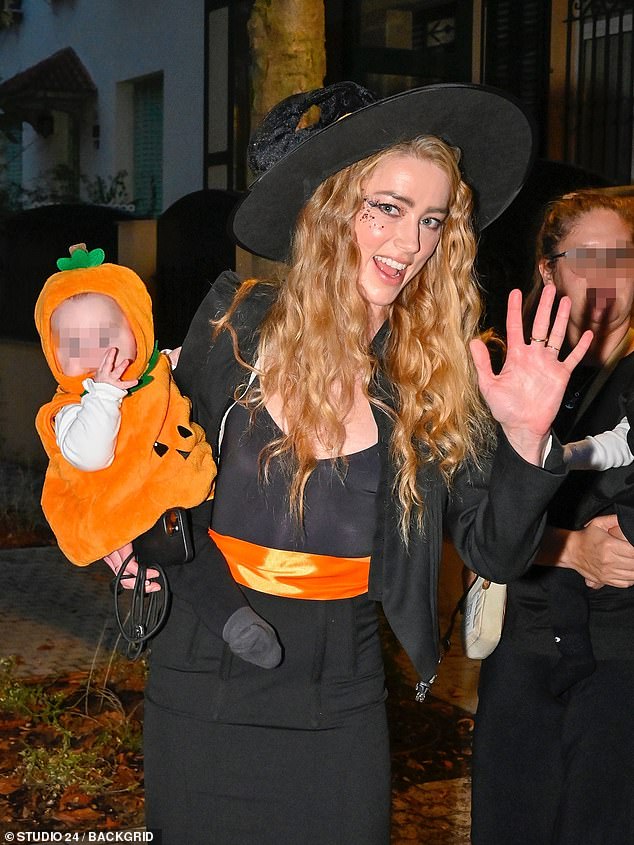 The Aquaman star waved to photographers as she went trick-or-treating on the autumn night