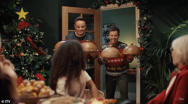 The duo then carry wooden cloches, the very same ones used to serve celebrities during the Bushtucker Trials