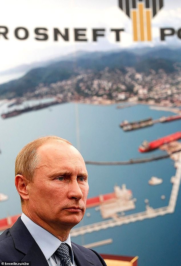 Vladimir Putin, right, visits Rosneft Russian oil refinery in 2012