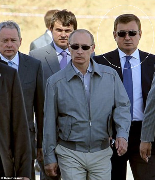 Former Putin bodyguard Alexei Dyumin, now a senior Putin aide, marked, pictured alongside Vladimir Putin
