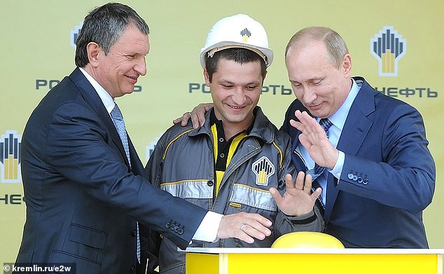 Vladimir Putin, right, visits Rosneft Russian oil refinery in 2012