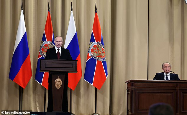 Vladimir Putin, left, next to him Head of Russian FSB Alexander Bortnikov
