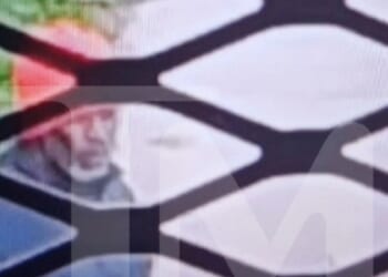 First pic of Diddy in jail shows disgraced star bundled up for walk with grey beard as he's snapped for 1st time in year