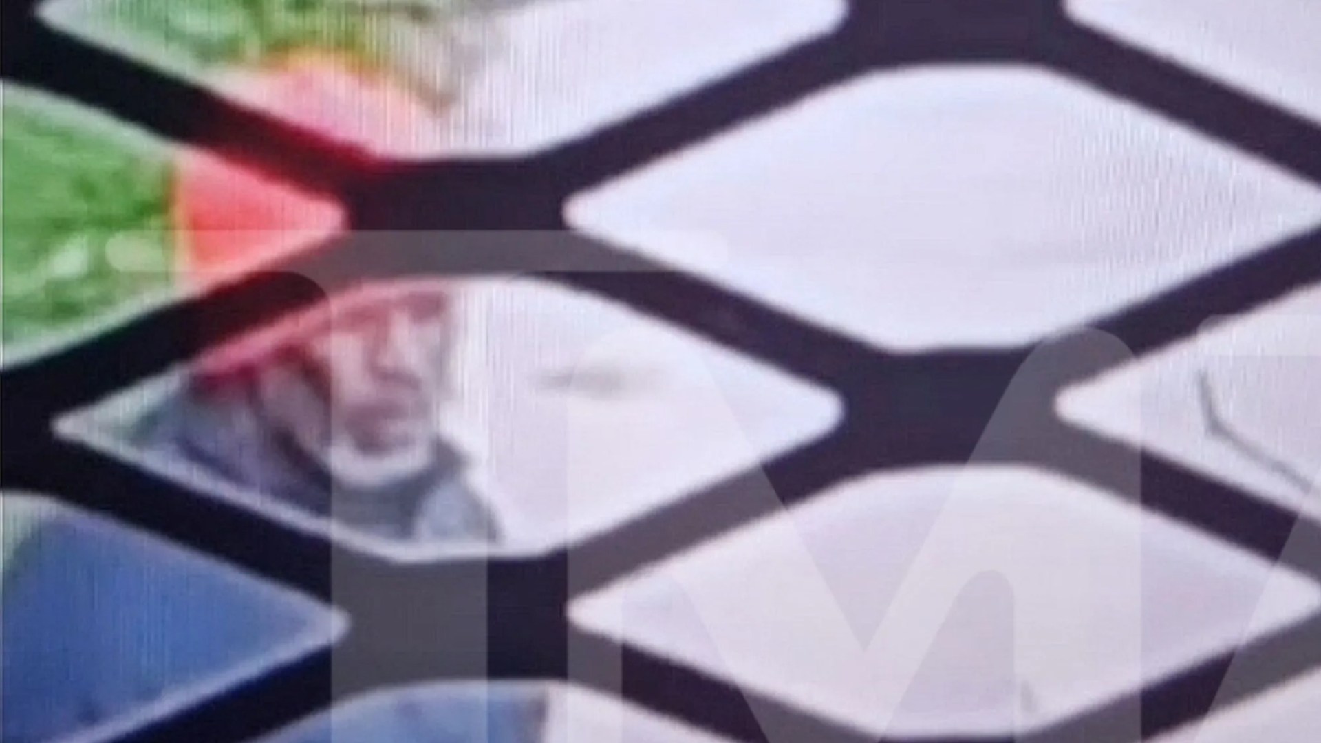 First pic of Diddy in jail shows disgraced star bundled up for walk with grey beard as he's snapped for 1st time in year