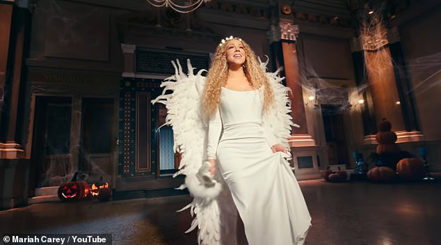 She can then be seen raising her arms as she declares with her famous phrase 'it's time' before the elf is turned into a snowman and she magically changes into a red belted Christmas dress