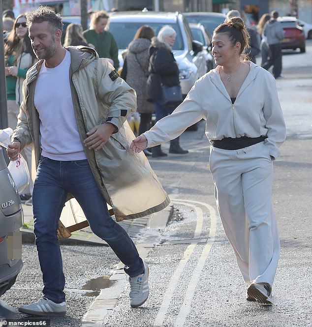 She went makeup free for their day out and pulled her hair back into a practical bun