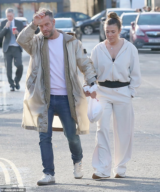 Heading out this weekend, they walked hand-in-hand through the Derbyshire town after picking up some shopping