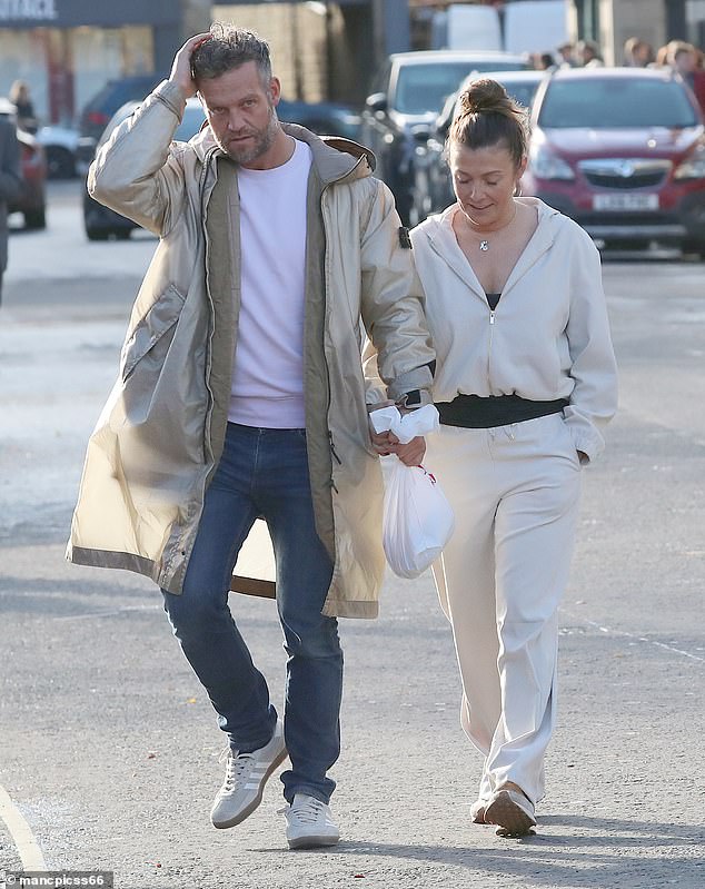 The couple are said to have met through friends and Kym has been intermittently sharing images with Tom - but only identified him in the latest post