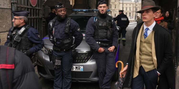 Woman, 38, charged over £76million Louvre jewels heist weeps in court as three suspects released without charge