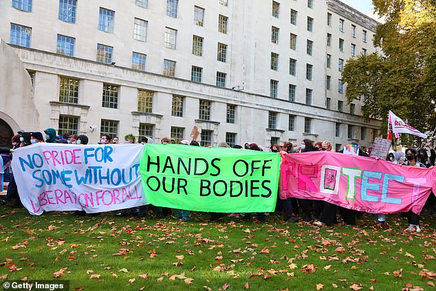 Banners in London which read: 'Hands off our bodies', and 'No pride for some without liberation for all'