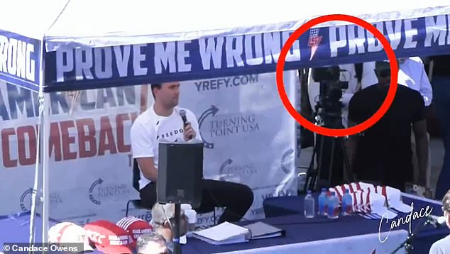 In the same episode of her podcast, Owens touted a conspiracy theory about the assassination and Kirk's right-hand man Mikey McCoy (circled, pictured moments before the shooting)