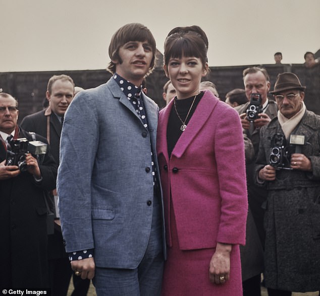 Drummer Maureen, who wears a pink suit over a black top, during their honeymoon in Hove, East Sussex, England, 12th February 1965.