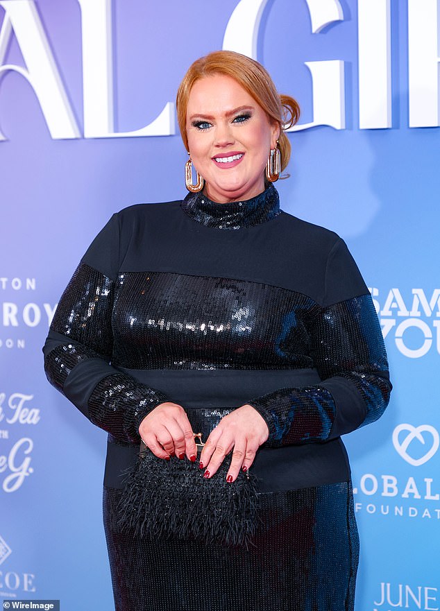 Donna Preston opted for a sequined navy long-sleeved dress and chunky hoop earrings