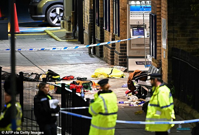 Paramedics medical equipment is pictured in side a police cordon outside the station following the attack