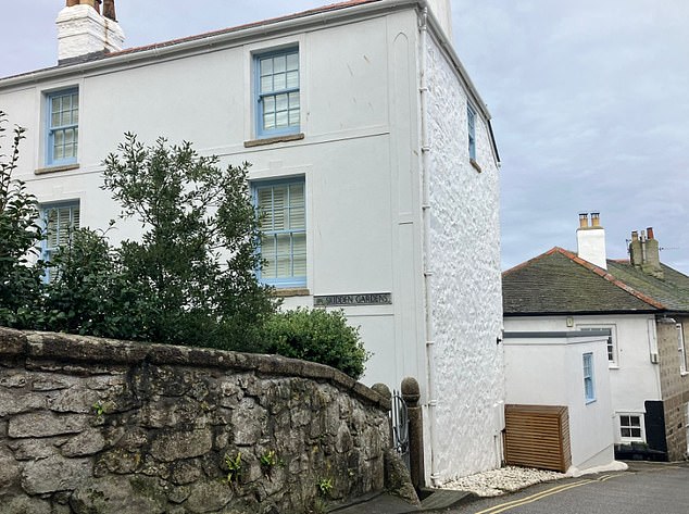 One told the Mail they had witnessed the police arrive on the sleepy road to escort the migrant away