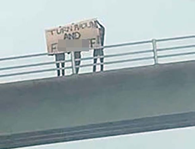 A crude 6ft-long banner - written in black paint on a white board - was held by three people to welcome tourists to Cornwall