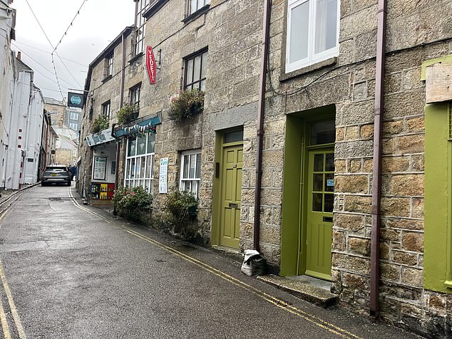 Shop owners and residents in St Ives, the county's most coveted destination, told the Daily Mail that they have noticed a huge decline in earnings and a drop-off in tourists this year (pictured: one of the many empty streets in St Ives)