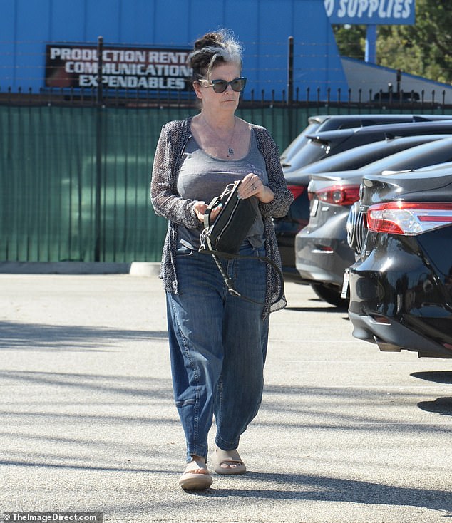 The 65-year-old actress was spotted running errands in Los Angeles this month, looking effortlessly chic in relaxed boyfriend jeans, a flowy gray top and a speckled gray cardigan layered over it