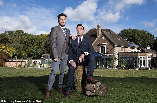 Craig pictured with his partner Jonathan Myring on the grounds of the stunning property