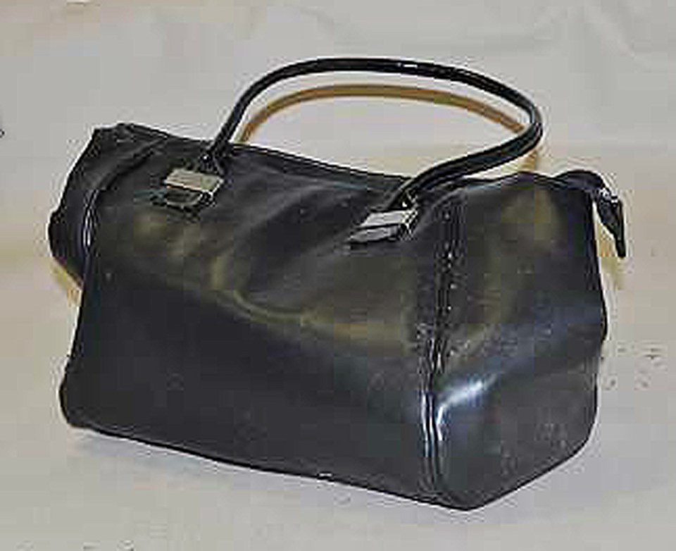 Black patent leather handbag with silver clasps.