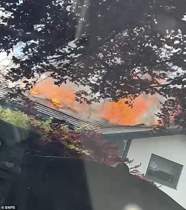 Footage of the incident shows bright orange flames leaping 20ft into the air as it tore through the large detached property in Dorset