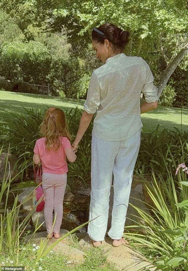 The former Suits actress uploaded a sweet image earlier this month, showing her holding hands with Lilibet as the pair explored the grounds of their house together. The little one was dressed in an all-pink outfit but seemingly decided against slippers or shoes