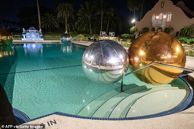 Giant balloons were placed in the pool for decoration while guests wore 1920s inspired outfits to the party