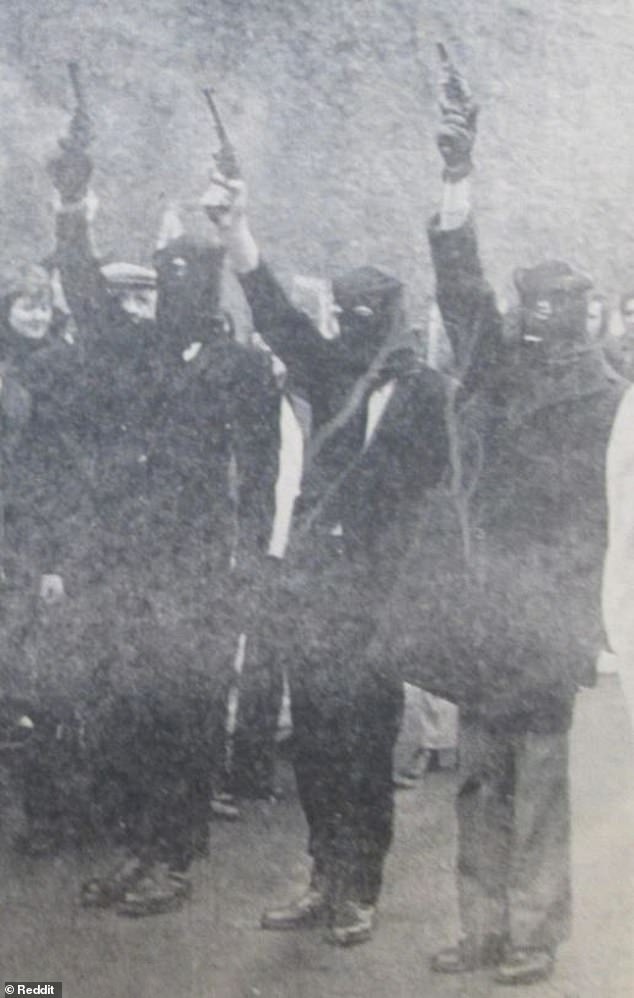 Soldier B denies shooting him and no other witnesses have suggested he was responsible. Picrured: masked IRA members hold their weapons aloft at Deviln's funeral