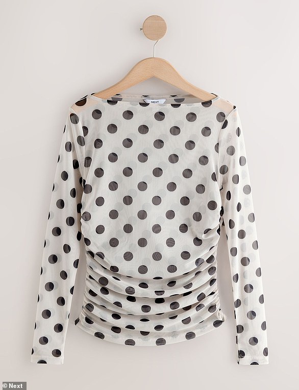 Looking to add some fun into your wardrobe? This £24 Ecru/Black Polka Dot Long Sleeve Ruched Side Mesh Top is the perfect choice