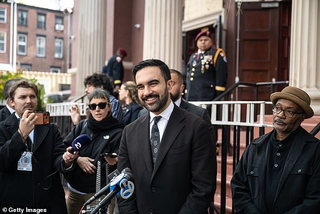 The president was first asked what he thought when interviewer Norah O'Donnell said Mamdani (pictured) had been described as a left-wing version of Trump. Trump responded: 'Well, I think I'm a much better looking person than him, right?'