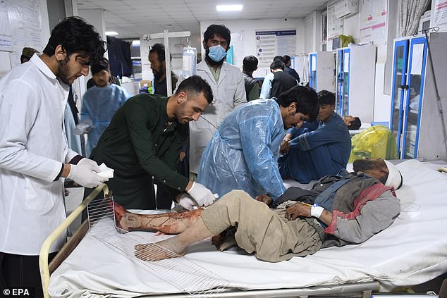 People who were injured in an earthquake receive treatment at a hospital in Mazar-i-Sharif, Afghanistan
